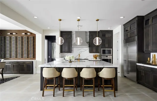 a kitchen with a table and chairs in it
