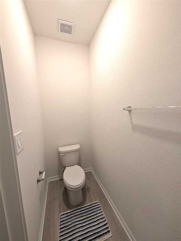 441 El Capitan Loop Dripping Springs, TX 78620 - Photo 12 of 26 a bathroom with a toilet and a shower