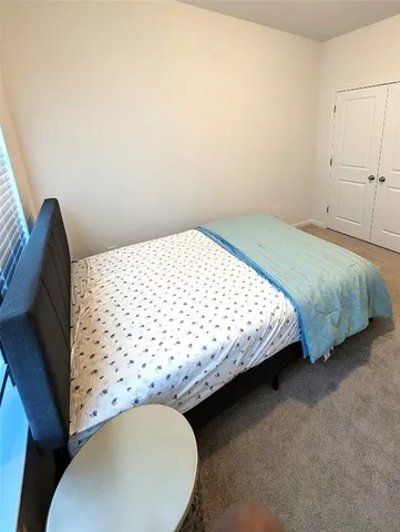 a bathroom with a sink a toilet a mirror and shower