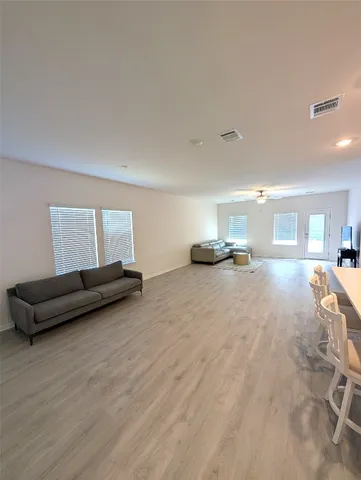 a living room with couch and a window