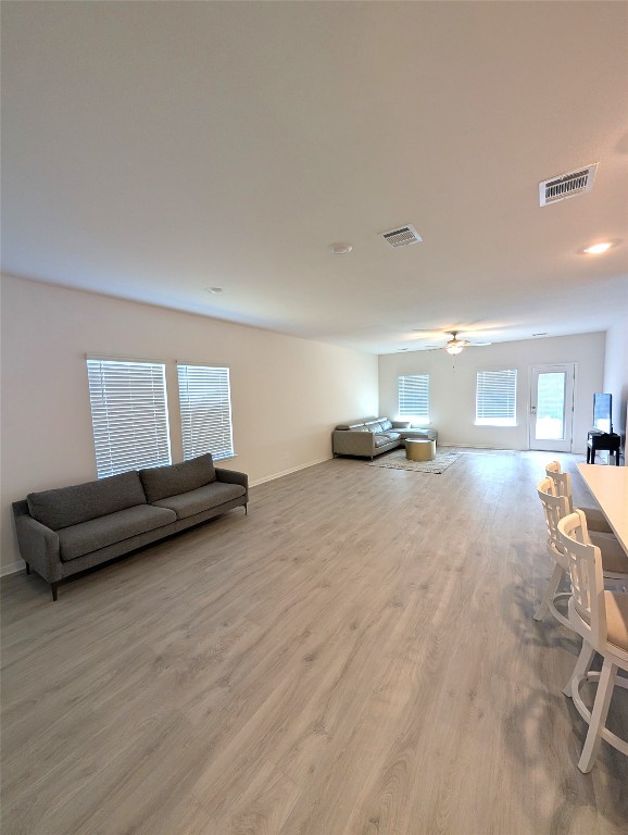 441 El Capitan Loop Dripping Springs, TX 78620 - Photo 5 of 26 a living room with couch and a window
