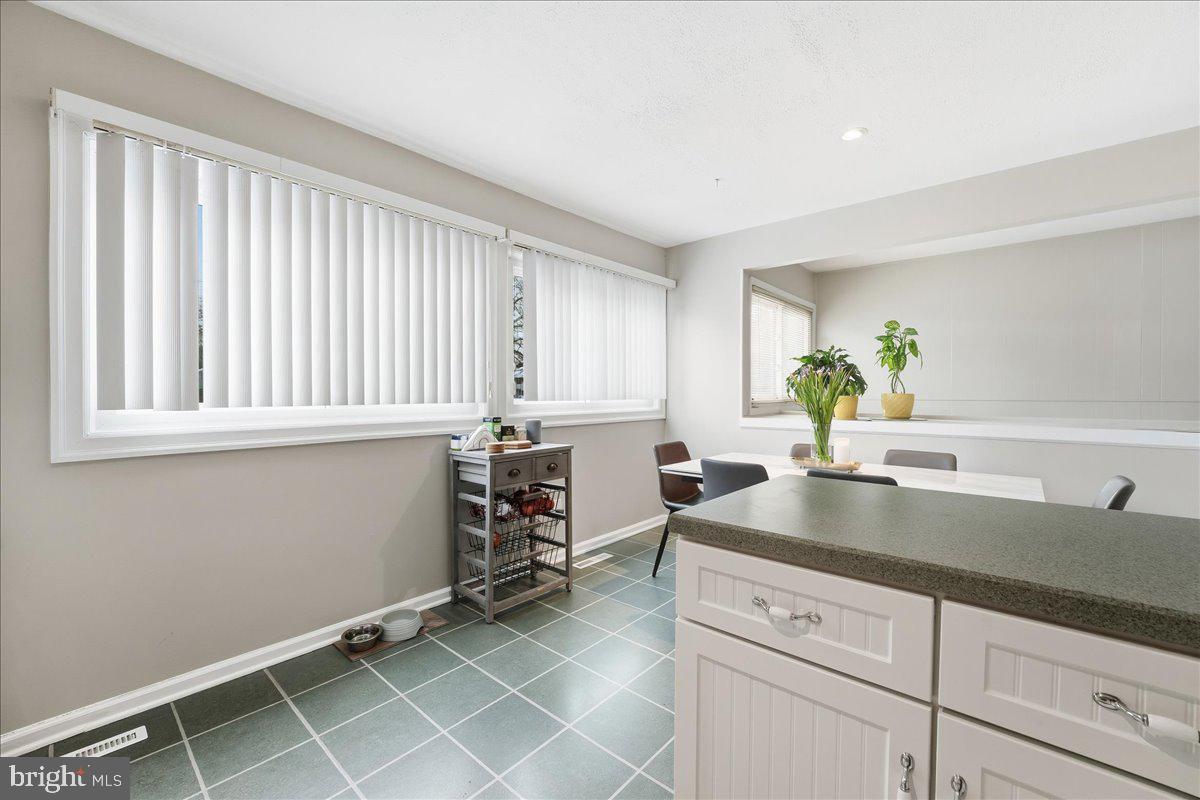 159 Henderson Place Hightstown, NJ 08520 - Photo 11 of 32 a kitchen with a sink cabinets and window