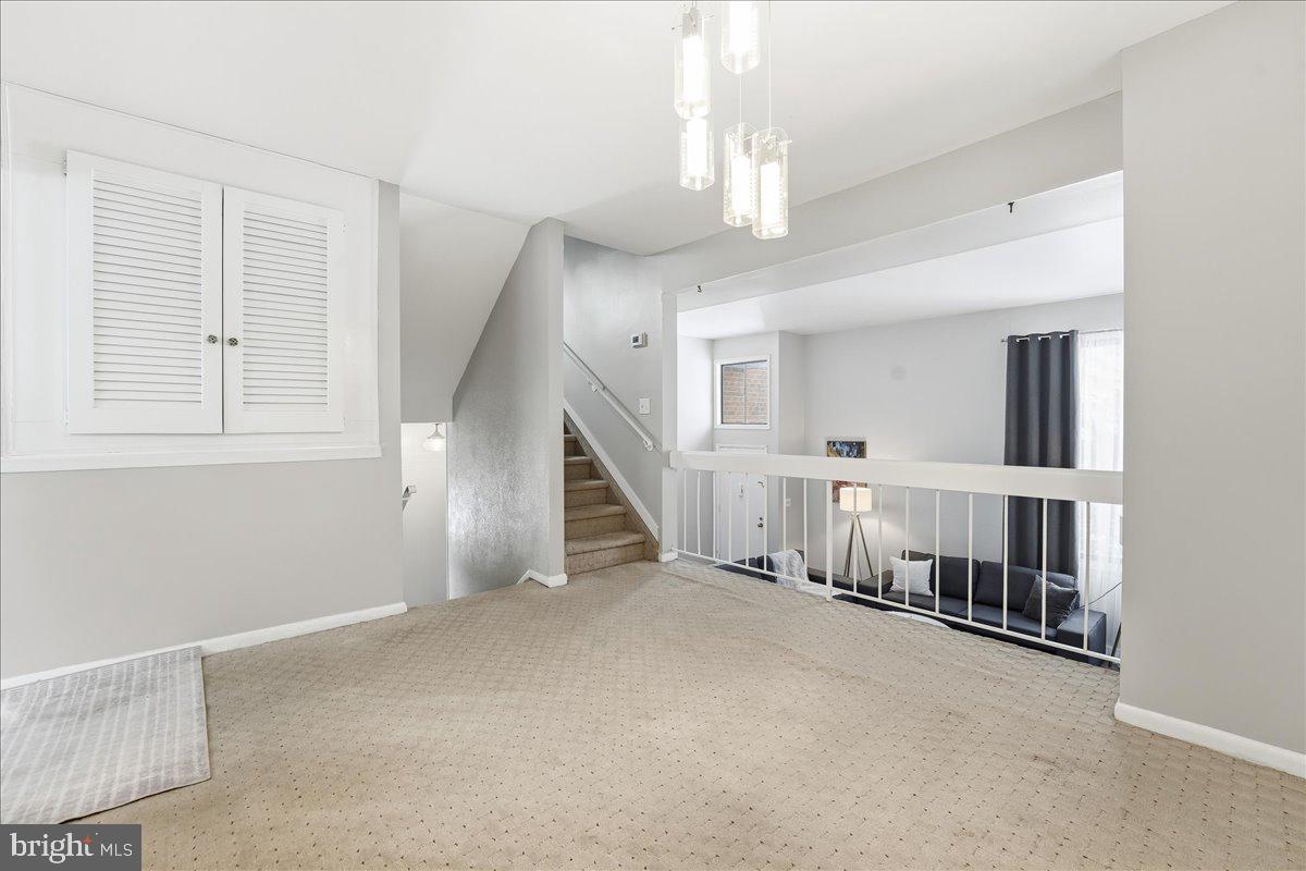 159 Henderson Place Hightstown, NJ 08520 - Photo 15 of 32 an empty room with fireplace and windows