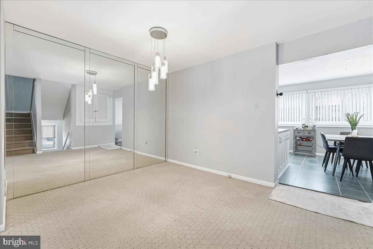 159 Henderson Place Hightstown, NJ 08520 - Photo 16 of 32 a view of a livingroom with furniture and a table in it