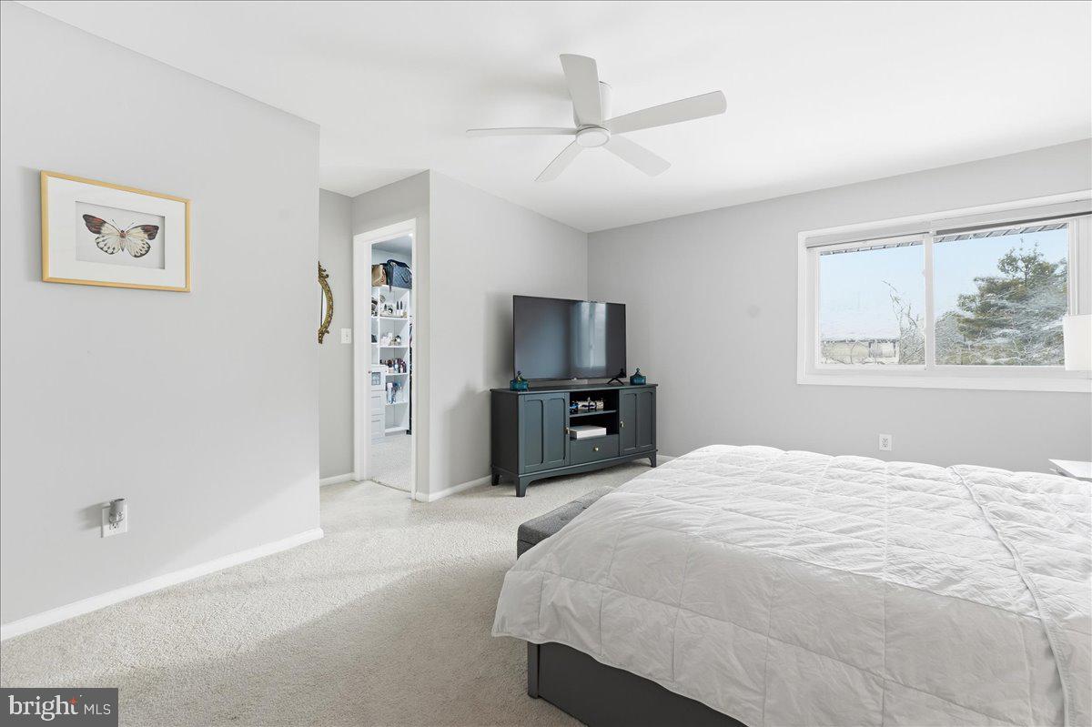 159 Henderson Place Hightstown, NJ 08520 - Photo 18 of 32 a bedroom with a bed and a television