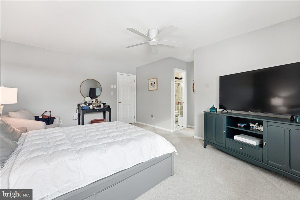 159 Henderson Place Hightstown, NJ 08520 - Photo 19 of 32 a bedroom with a bed and a flat screen tv