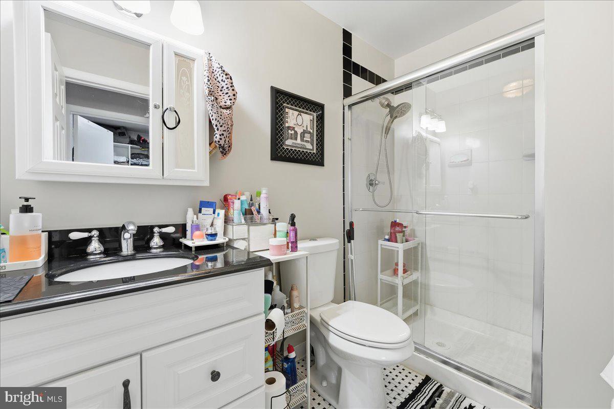 159 Henderson Place Hightstown, NJ 08520 - Photo 20 of 32 a bathroom with a sink vanity mirror and toilet