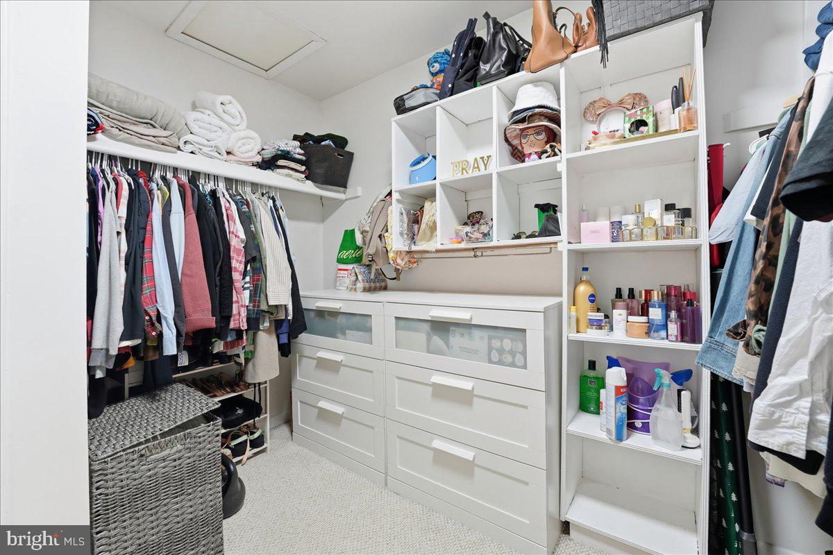 159 Henderson Place Hightstown, NJ 08520 - Photo 21 of 32 a view of walk in closet with clothes and shoes