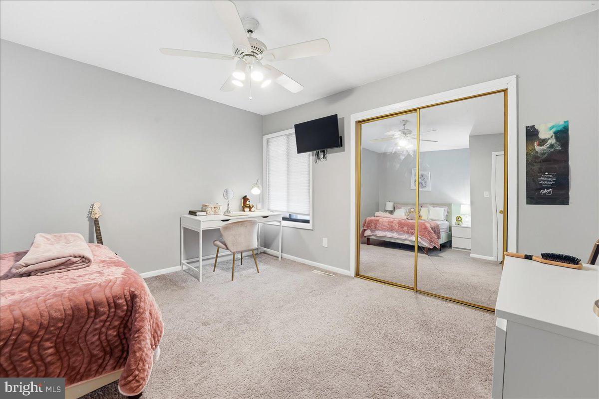 159 Henderson Place Hightstown, NJ 08520 - Photo 23 of 32 a living room with furniture and a table
