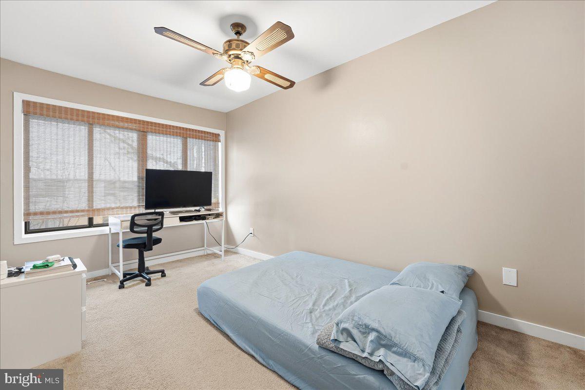159 Henderson Place Hightstown, NJ 08520 - Photo 25 of 32 a living room with furniture and a flat screen tv