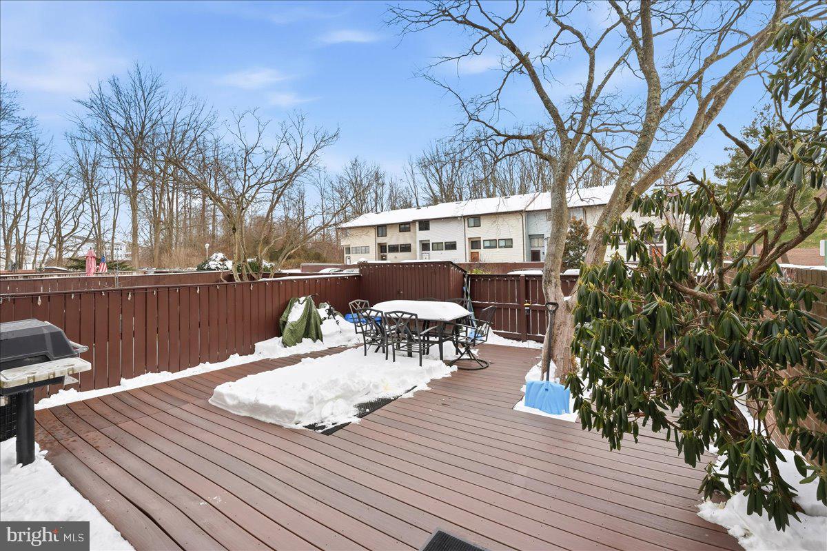 159 Henderson Place Hightstown, NJ 08520 - Photo 3 of 32 a view of a chairs and table on the wooden deck