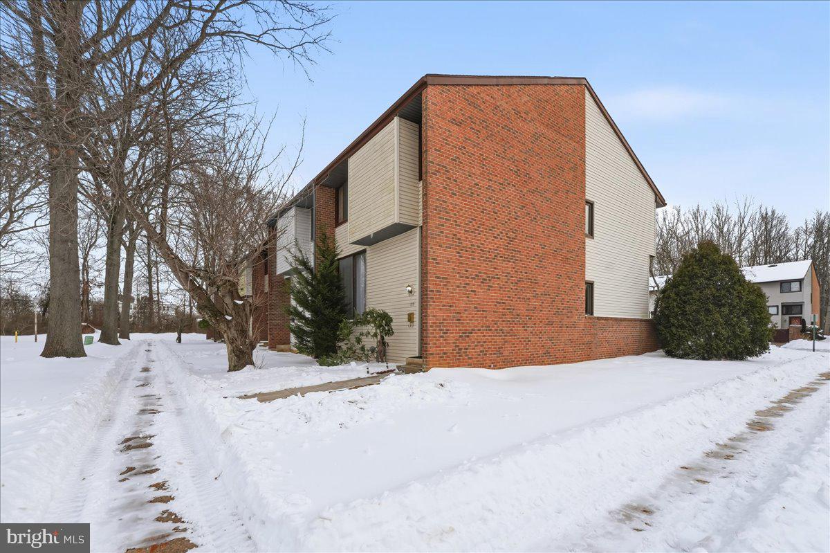159 Henderson Place Hightstown, NJ 08520 - Photo 32 of 32 a view of a house with a yard covered in snow