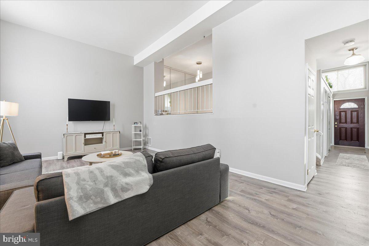 159 Henderson Place Hightstown, NJ 08520 - Photo 4 of 32 a living room with furniture and a flat screen tv