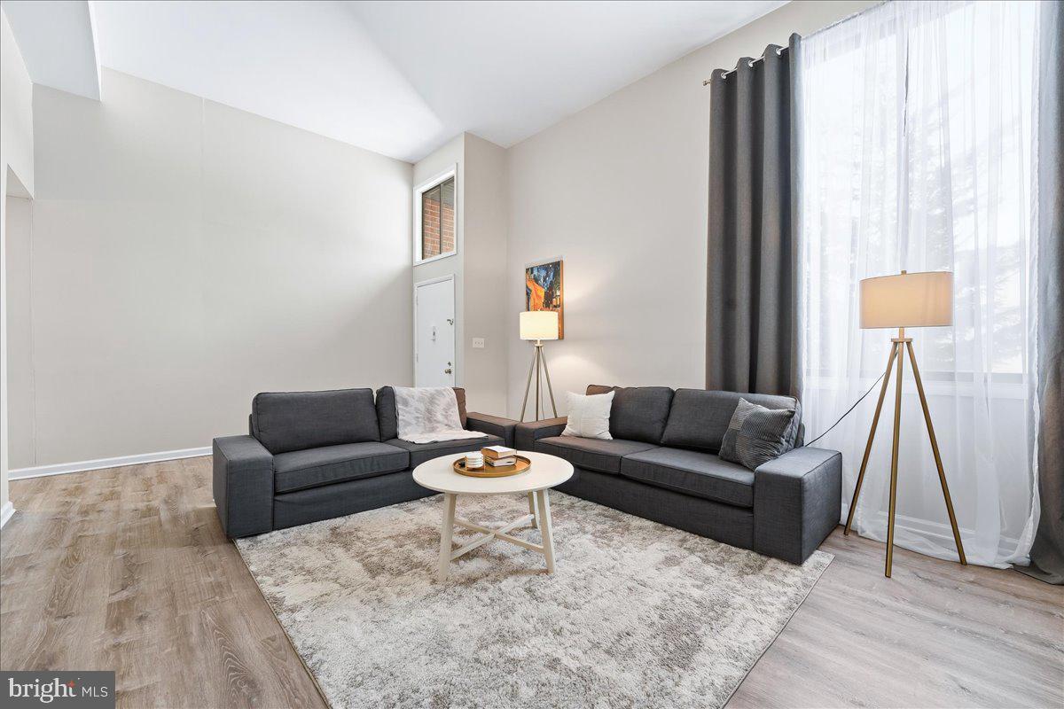 159 Henderson Place Hightstown, NJ 08520 - Photo 5 of 32 a living room with furniture and a window