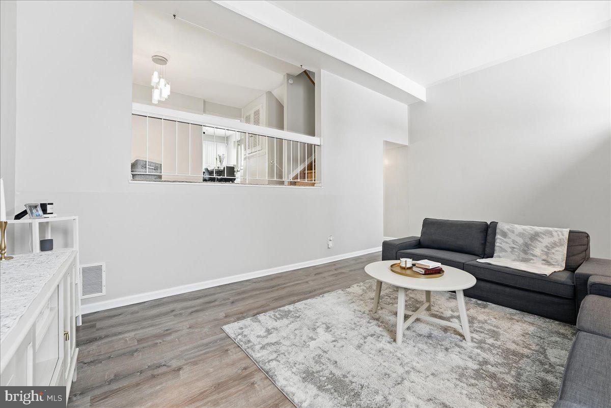 159 Henderson Place Hightstown, NJ 08520 - Photo 6 of 32 a living room with furniture and wooden floor