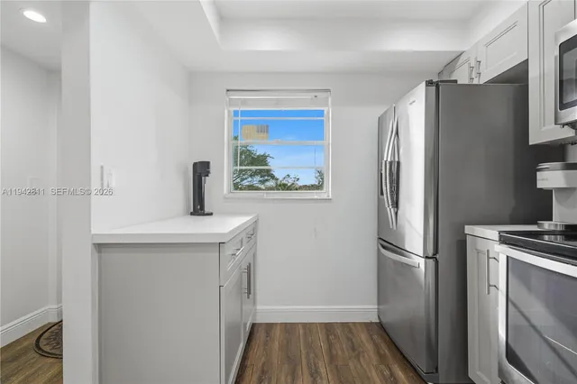 a view of a dining room with furniture wooden floor and chandelier