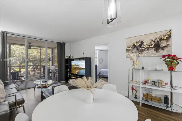 a view of house with outdoor space and trees