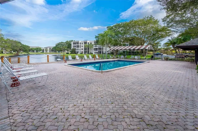 a kitchen with stainless steel appliances a stove microwave and refrigerator
