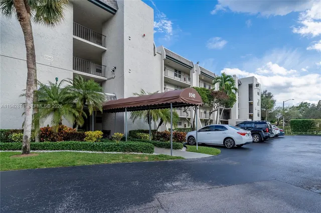 an aerial view of a house with a yard and garden