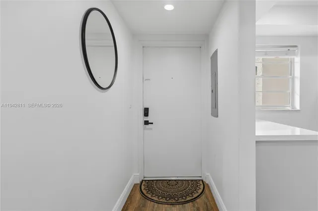 a view of a house with a patio and a yard