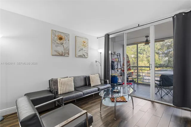 a living room with furniture and a window
