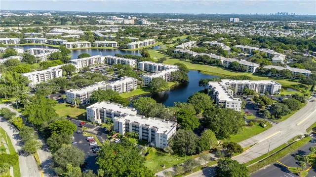 a view of a hallway to rooms and wooden floor
