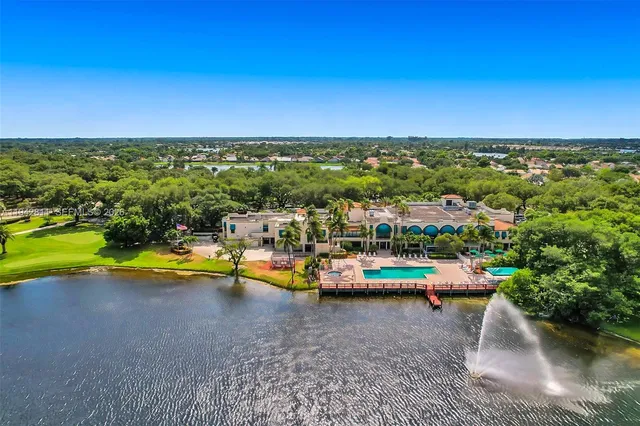 a living room with a couch and a chandelier