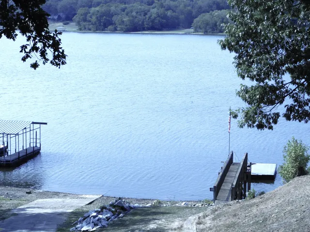 a view of a bench in wooden floor