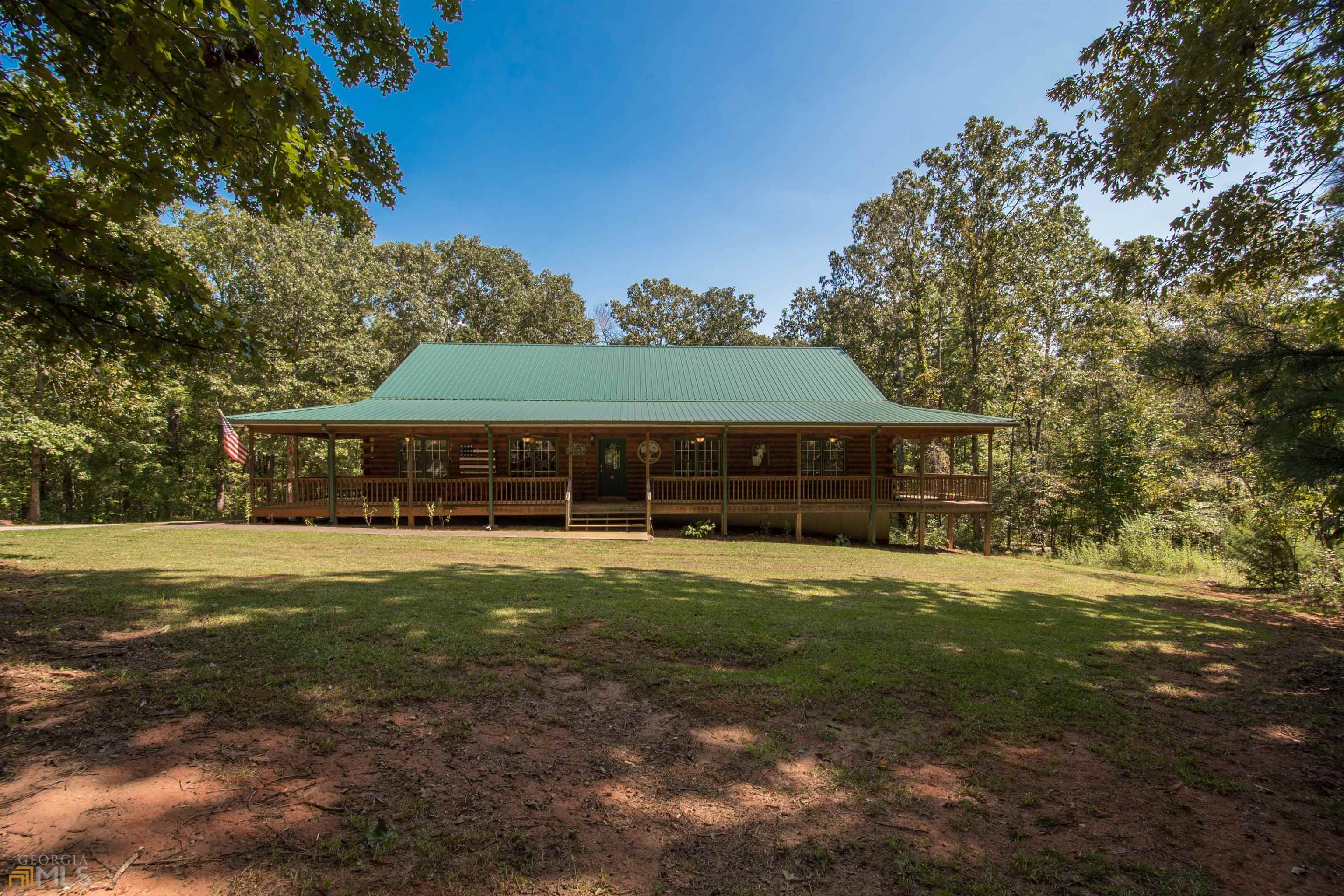 390 Holbrook Road Newnan, GA 30263 - Photo 1 of 1 a front view of a house with a garden