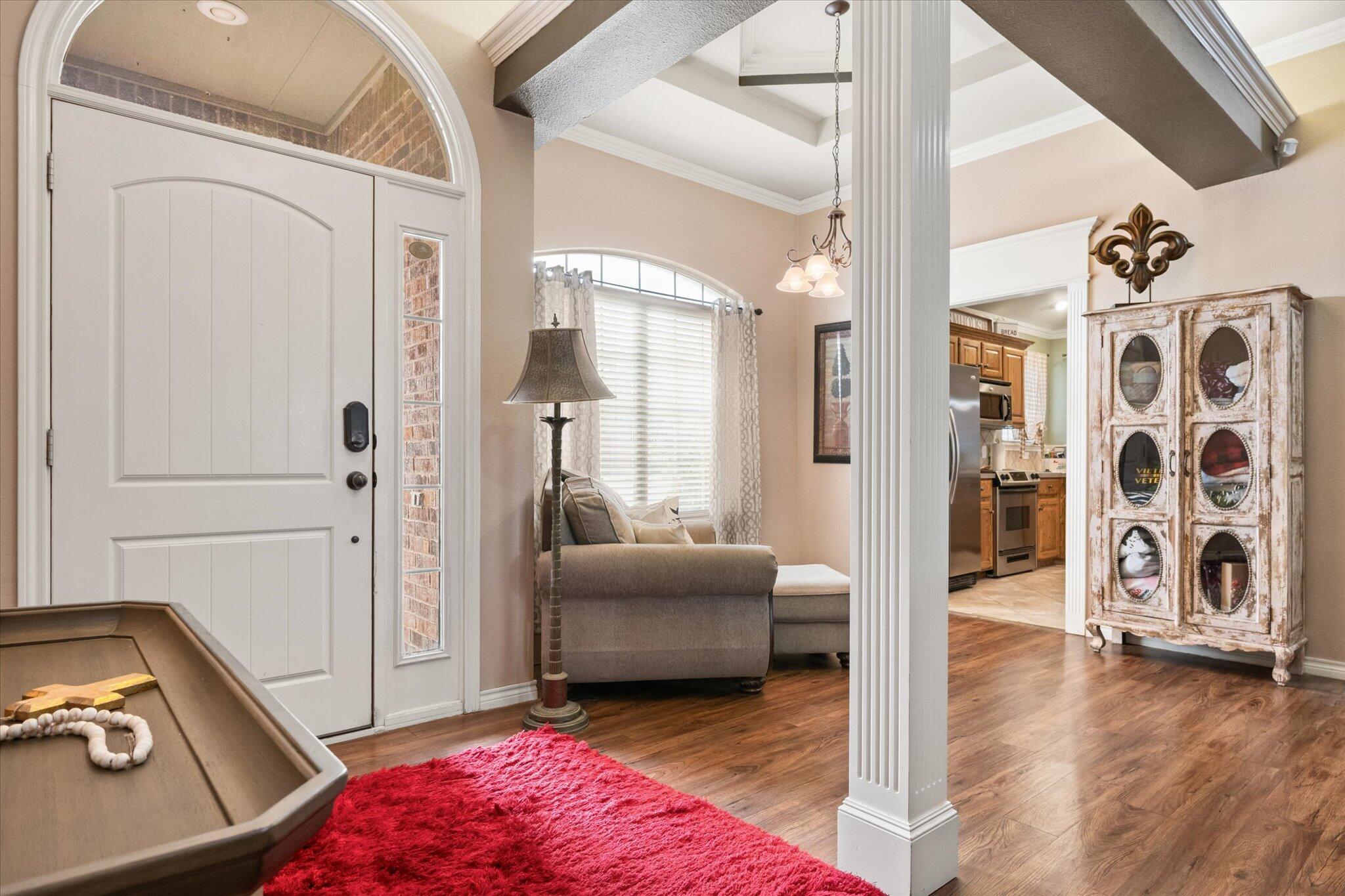 5838 101st Street Lubbock, TX 79424 - Photo 12 of 37 a view of a livingroom with furniture and hardwood floor