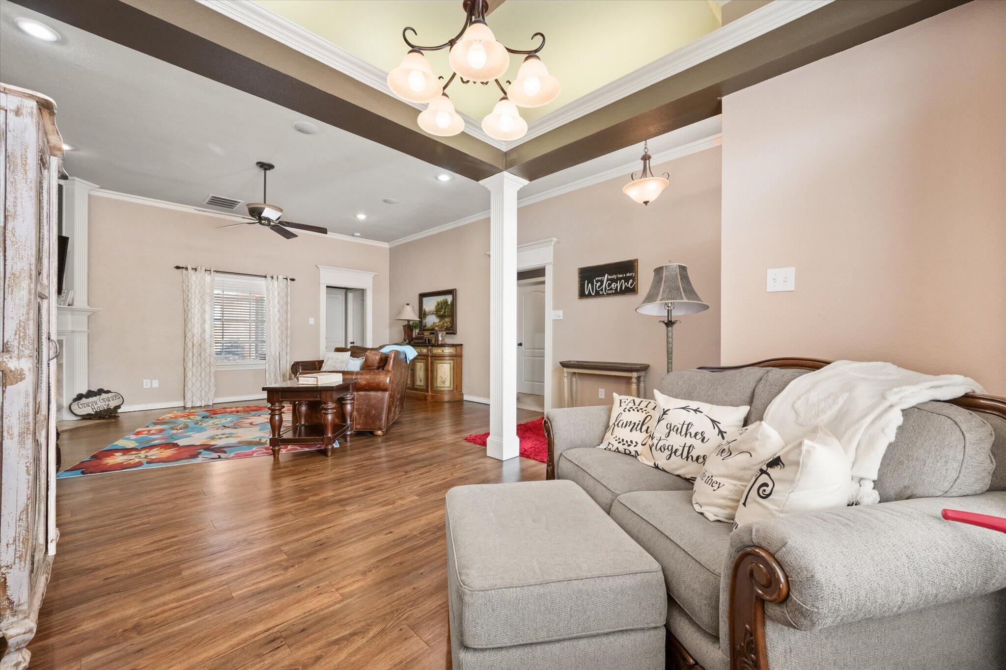5838 101st Street Lubbock, TX 79424 - Photo 14 of 37 a living room with furniture and wooden floor