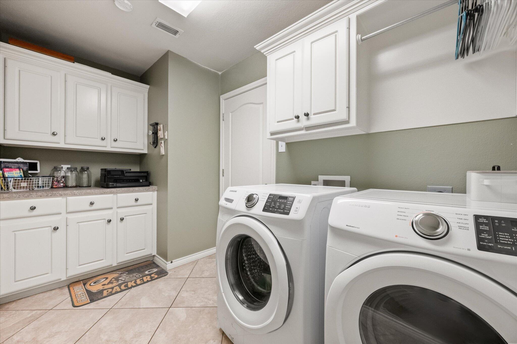 5838 101st Street Lubbock, TX 79424 - Photo 26 of 37 a utility room with dryer and washer