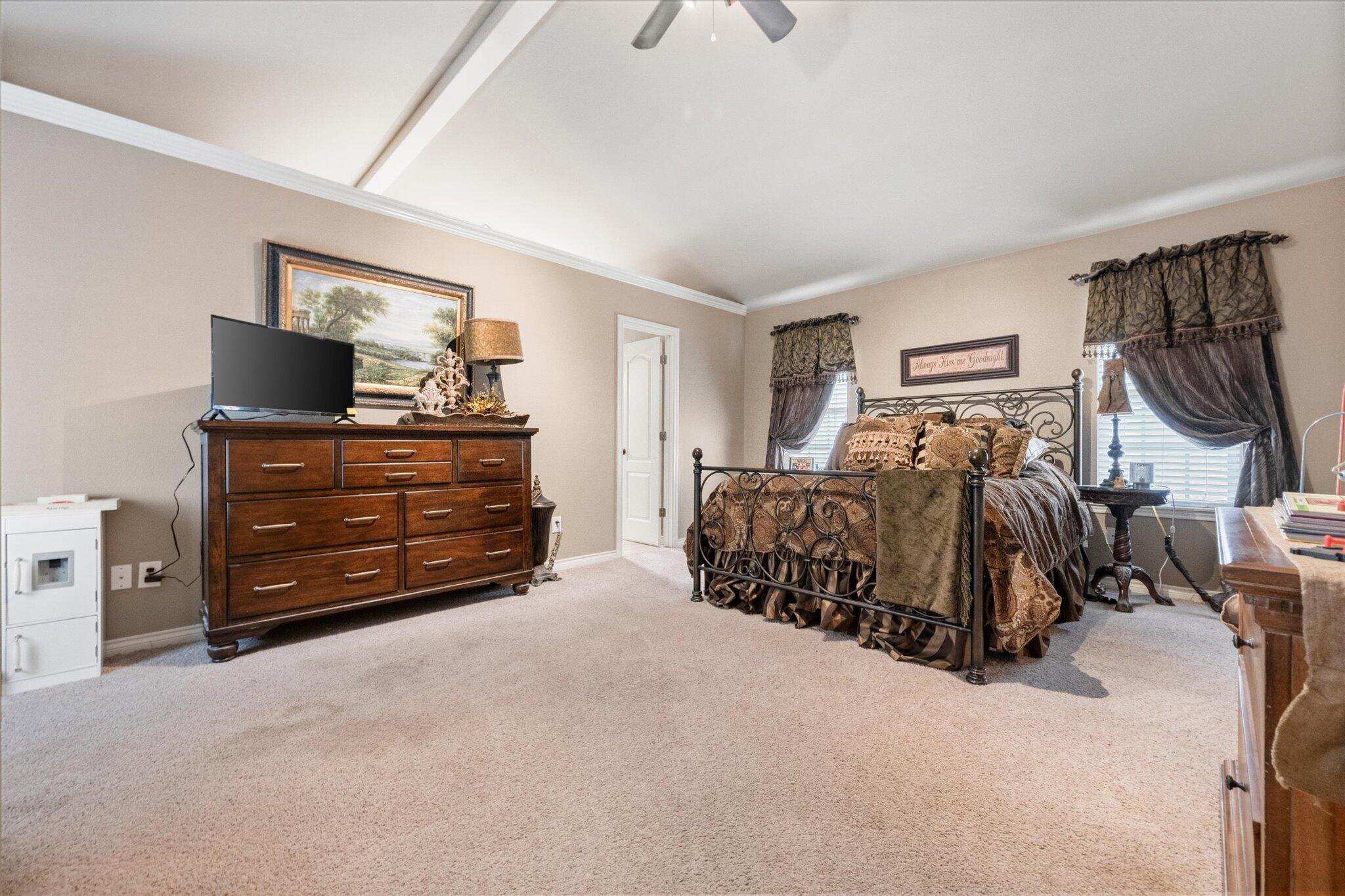 5838 101st Street Lubbock, TX 79424 - Photo 30 of 37 a bed room with a bed and a television