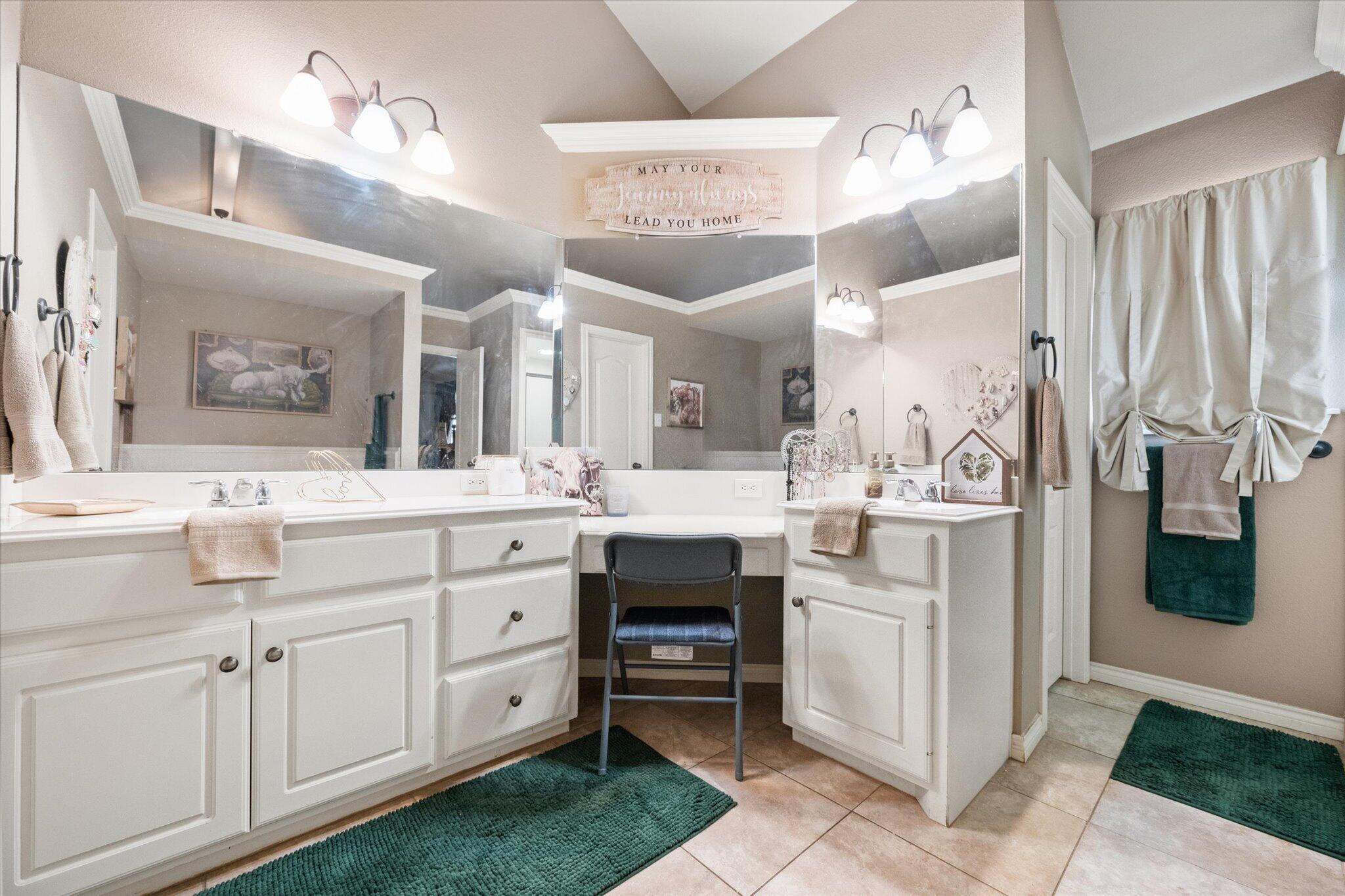 5838 101st Street Lubbock, TX 79424 - Photo 34 of 37 a spacious bathroom with a double vanity sink a mirror and a