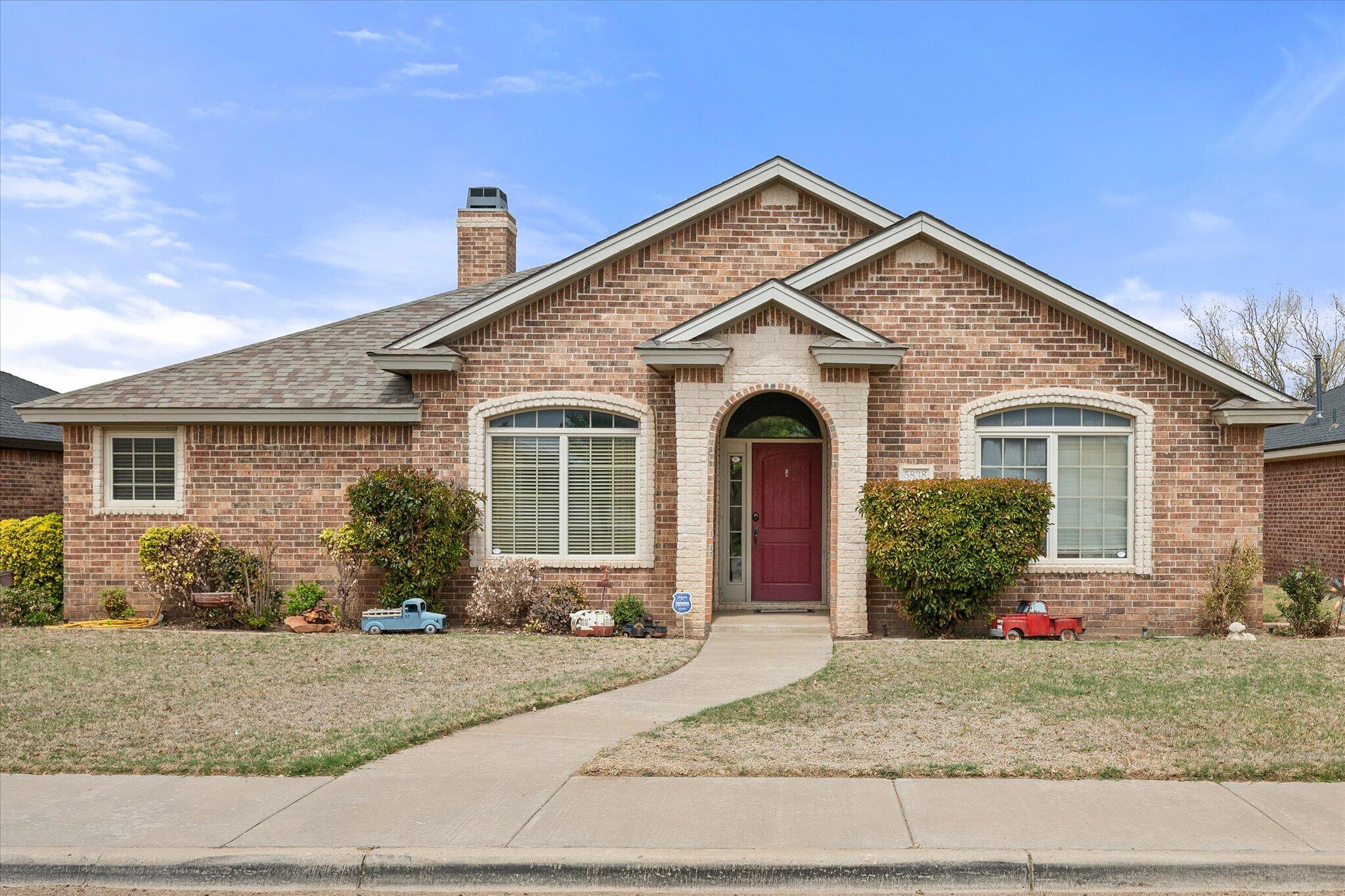 5838 101st Street Lubbock, TX 79424 - Photo 4 of 37 a front view of a house with garden