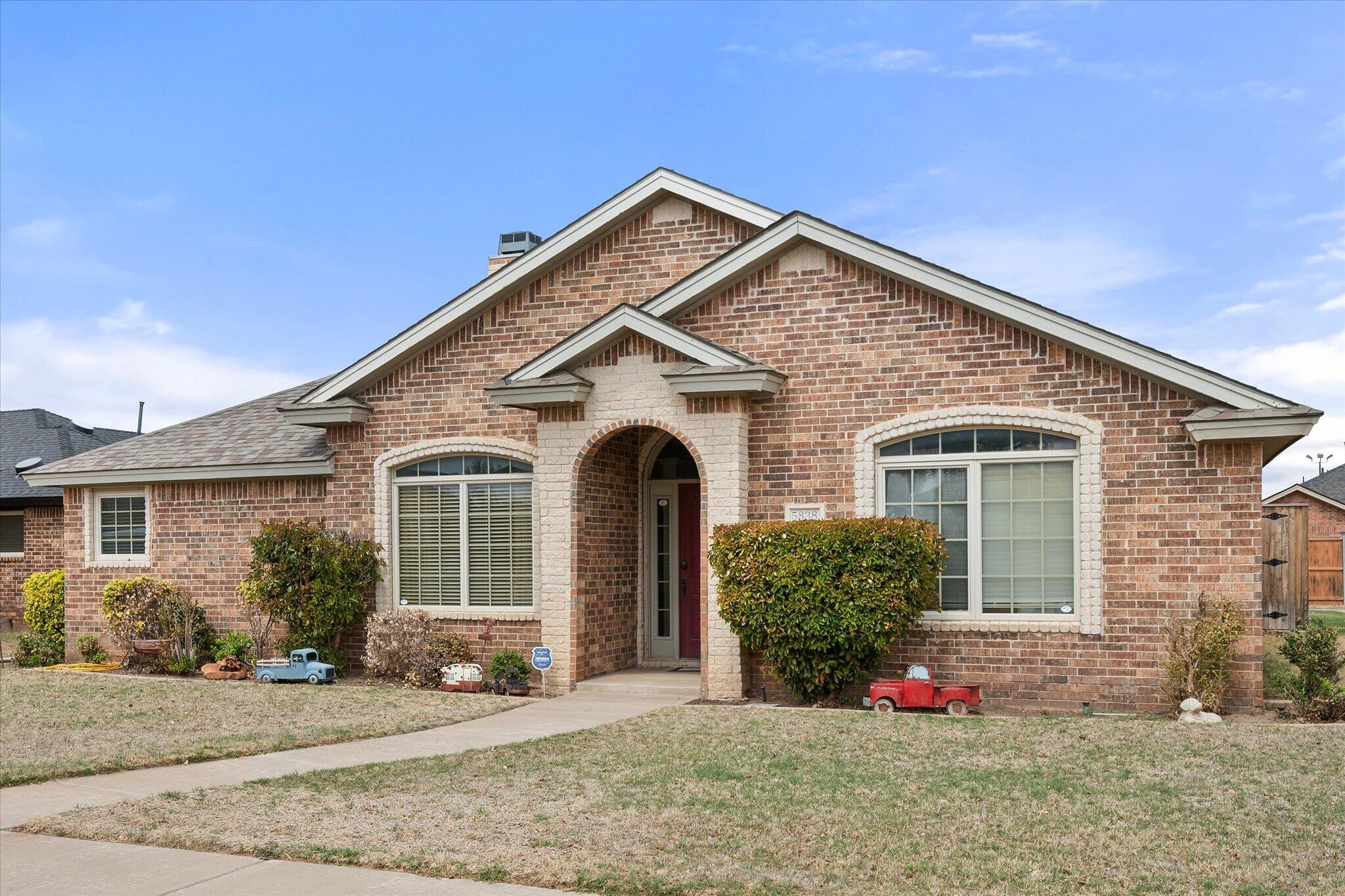 5838 101st Street Lubbock, TX 79424 - Photo 6 of 37 a front view of a house with garden