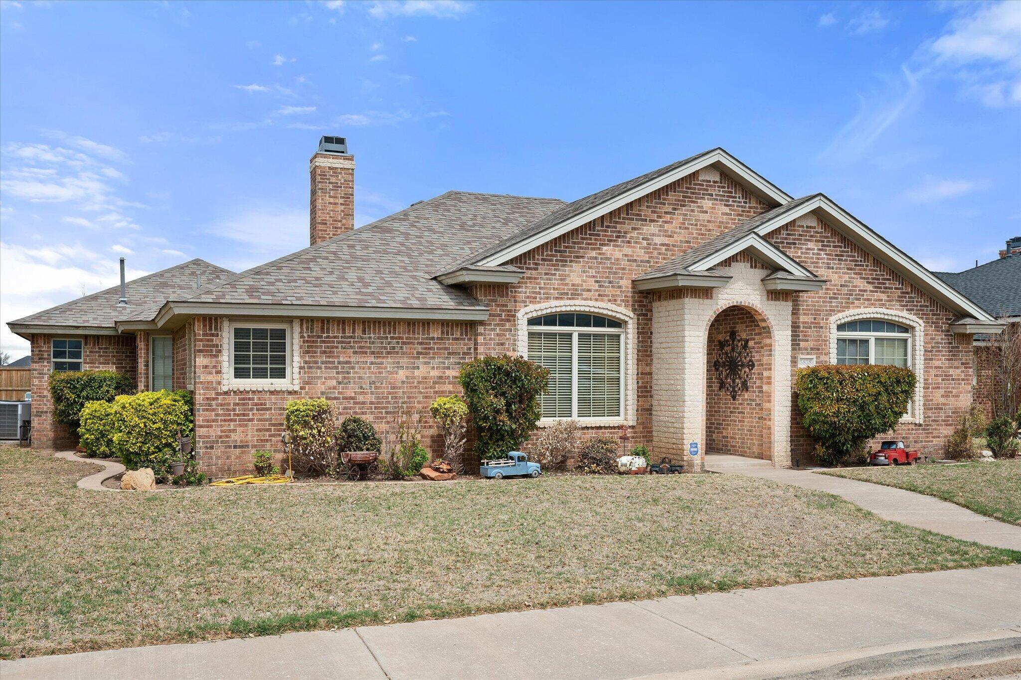 5838 101st Street Lubbock, TX 79424 - Photo 8 of 37 a front view of a house with garden