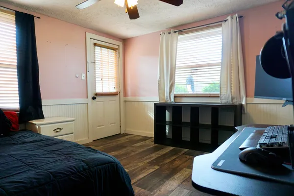 a bedroom with a bed and a window