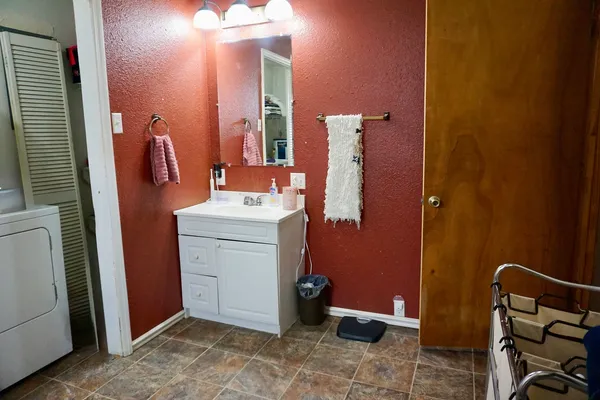 a bathroom with a sink and a mirror