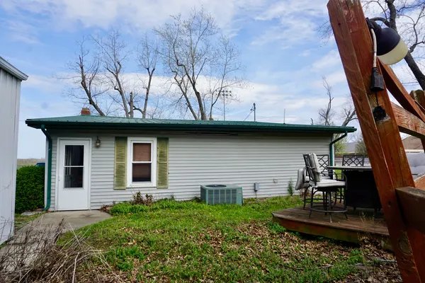 a view of backyard with seating space