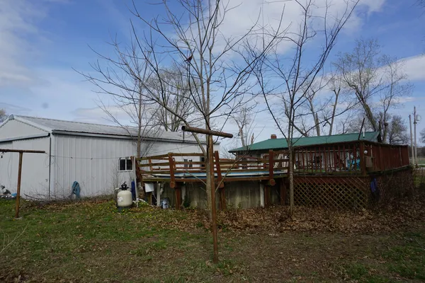 a view of house with outdoor space and sitting area