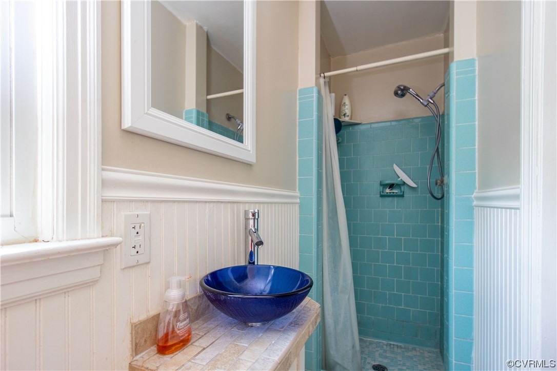 1305 Covington Road Colonial Heights, VA 23834 - Photo 16 of 34 a bathroom with a sink and a mirror
