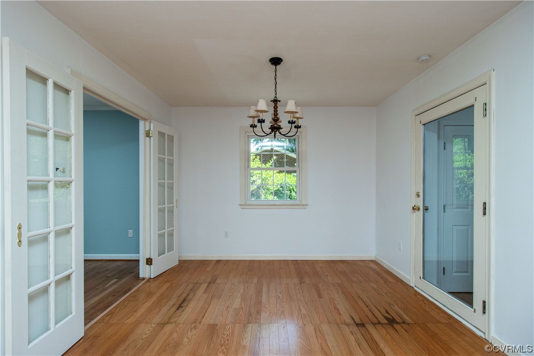 1305 Covington Road Colonial Heights, VA 23834 - Photo 17 of 34 wooden floor in an empty room with a window