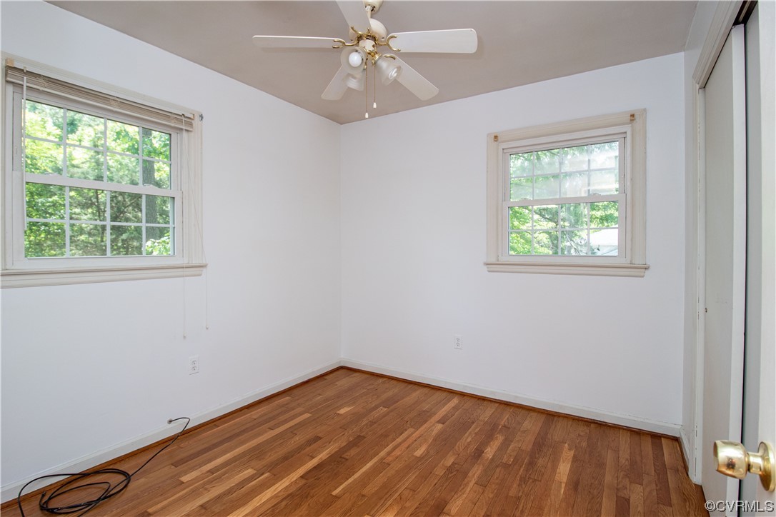 1305 Covington Road Colonial Heights, VA 23834 - Photo 26 of 34 an empty room with a window and wooden floor