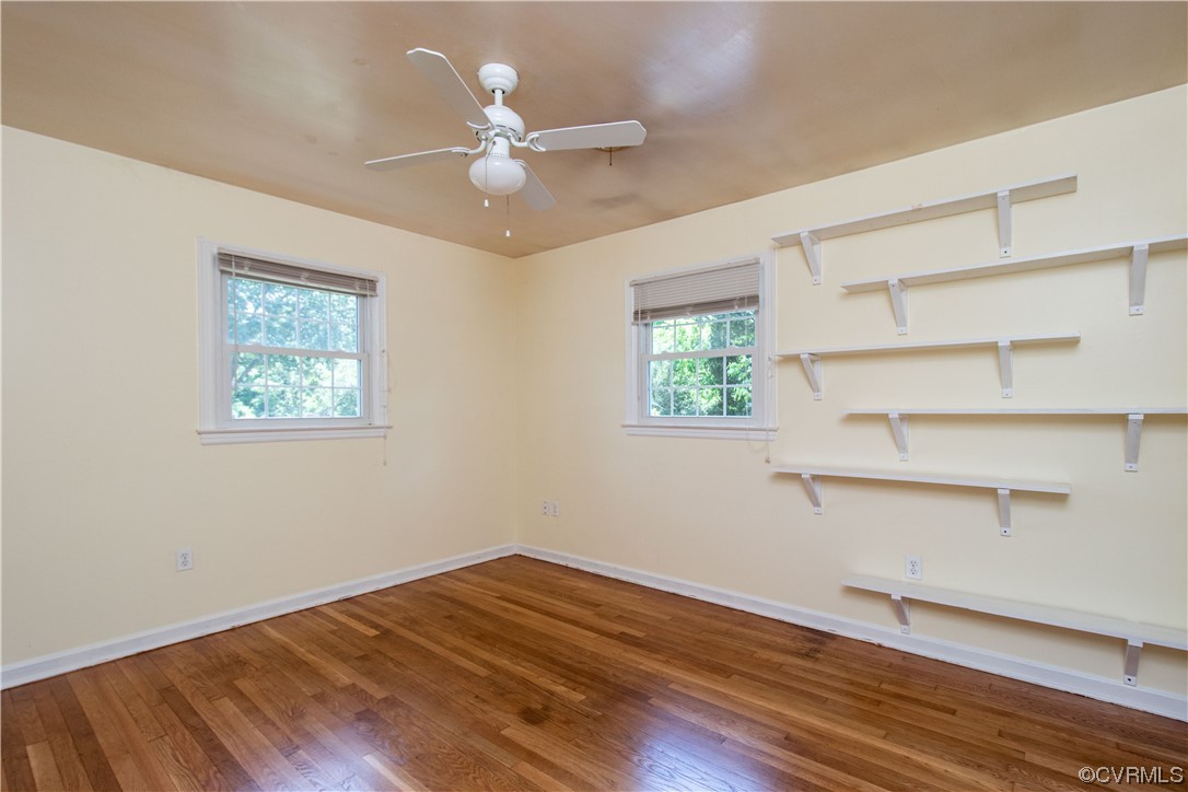 1305 Covington Road Colonial Heights, VA 23834 - Photo 28 of 34 a view of an empty room with a window and wooden floor