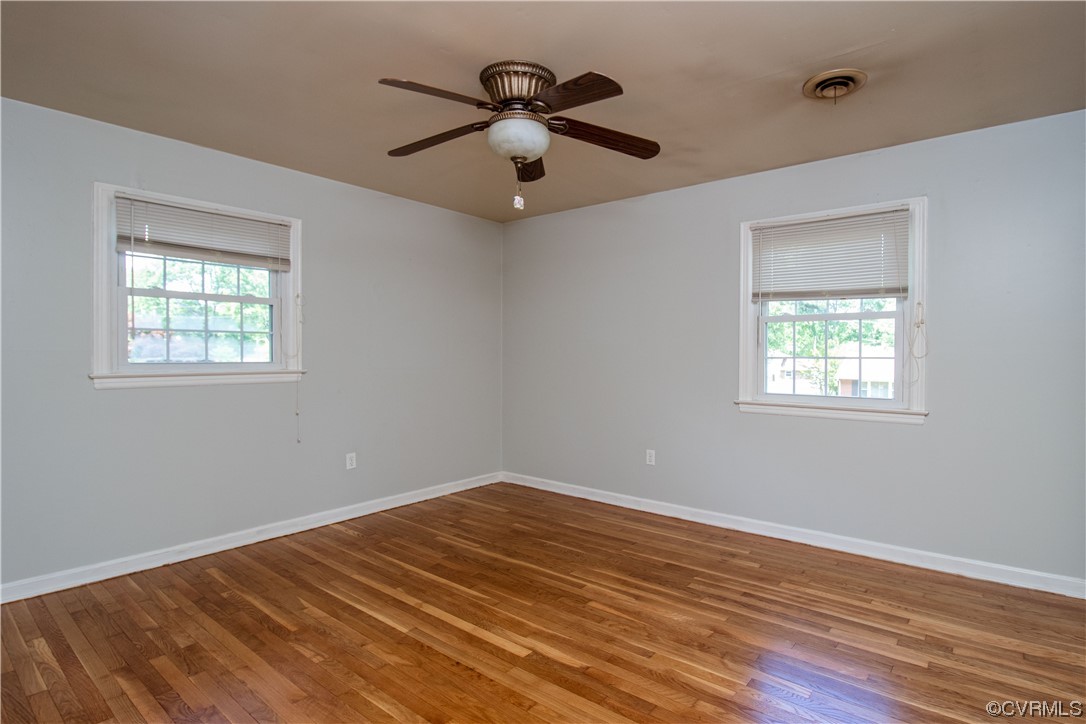 1305 Covington Road Colonial Heights, VA 23834 - Photo 29 of 34 a view of empty room with wooden floor and fan
