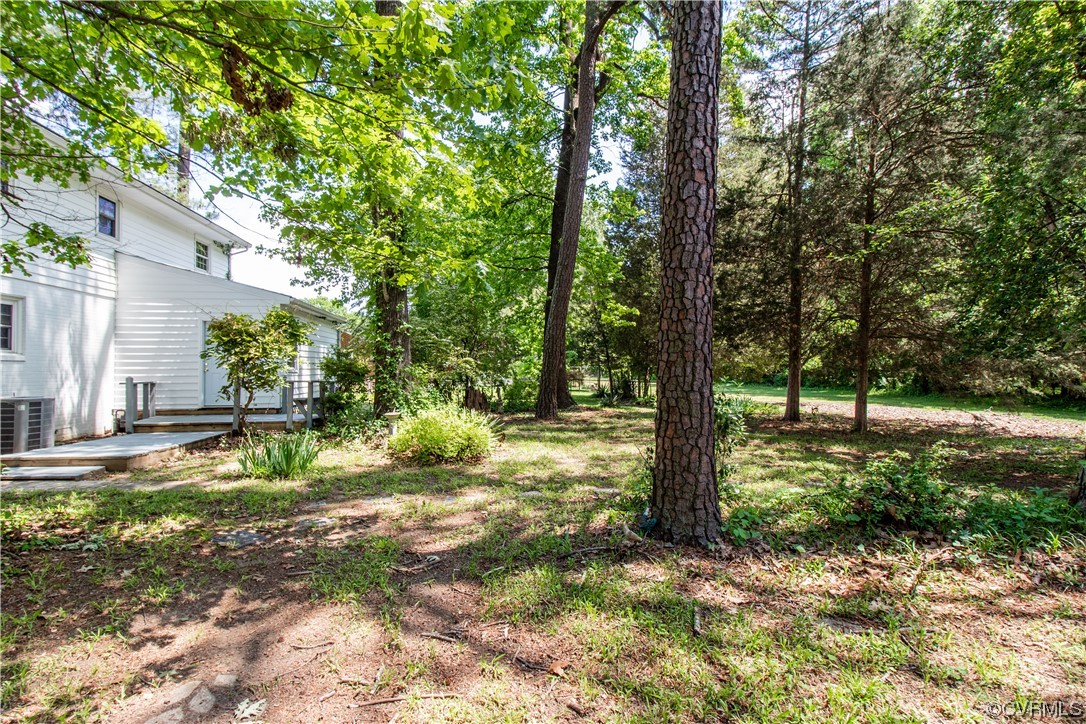 1305 Covington Road Colonial Heights, VA 23834 - Photo 34 of 34 a view of a yard with plants and large trees
