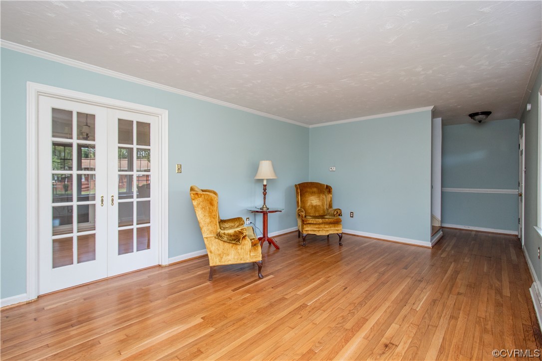 1305 Covington Road Colonial Heights, VA 23834 - Photo 5 of 34 a view of a room with wooden floor lounge chair and windows