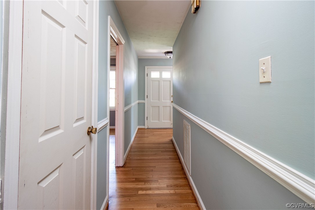 1305 Covington Road Colonial Heights, VA 23834 - Photo 8 of 34 a view of a hallway with wooden floor and staircase