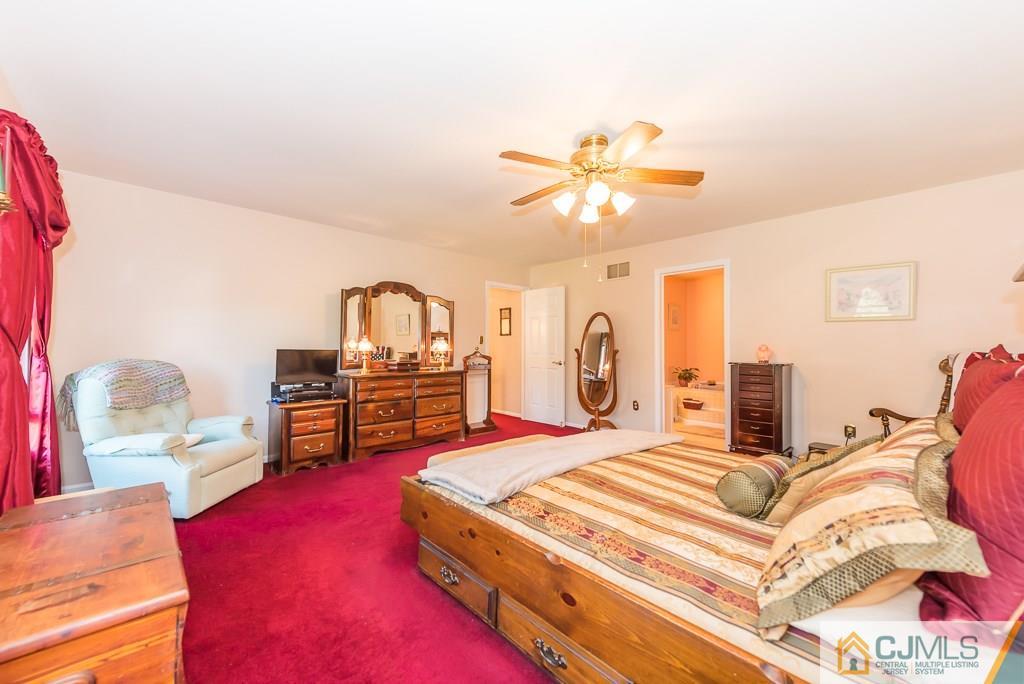 14 Crest Road Jackson, NJ 08527 - Photo 13 of 24 a bedroom with a bed dresser and a dining table